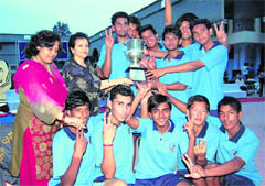 The team of Raja Ram Mohan Roy Academy with the AC Deb Memorial Senior Boys Basketball Tournament trophy in Dehradun on Friday.