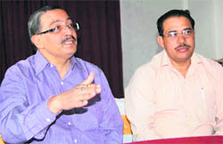 Mukesh Kumar, general secretary of the Judo Federation of India (left) addresses a press conference in Dehradun on Friday. 