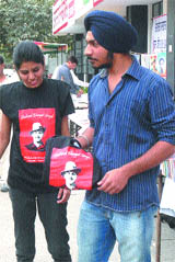 Students buy T-shirts of Shaheed Bhagat Singh in Jalandhar on Friday