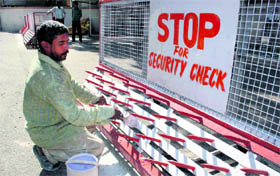 With the Darbar move round the corner, a worker is busy painting a barricade in front of the Civil Secretariat in Jammu.