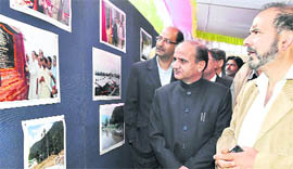 Deputy Chief Minister Tara Chand goes round an exhibition on Dal Lake in Srinagar.