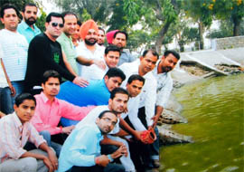 Activists of the Youth Congress, Bathinda block, immerse the remains of a burnt effigy of Deputy CM Sukhbir Singh Badal in GNDTP lake number three in Bathinda on Saturday.