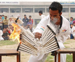 A contestant performs a martial art at the 56th Inter-district School Games being organised at MSD Senior Secondary School in Bathinda on Saturday.