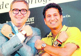 Audemars Piguet brand ambassador Sachin Tendulkar along with Oliviero Bottinelli, MD, Audemars Piguet (India), showcase the company's watches during a promotional event in New Delhi on Friday. 