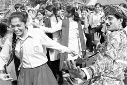 School students dance with artistes during the Crafts Mela at Kalagram, Chandigarh, on Saturday
