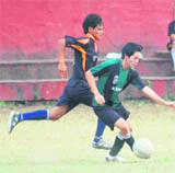 Players vie for the ball at the Ram Bahadur Chetri Memorial Inter-School Football Tournament in Dehradun on Saturday