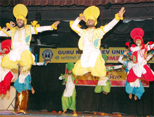 Students perform bhangra during the Inter-Zonal Youth Festival of Guru Nanak Dev University in Amritsar on Saturday.