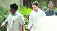 AICC general secretary Rahul Gandhi leaves after a meeting with HRD Minister Kapil Sibal in New Delhi