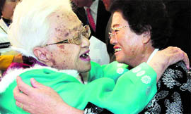South Koreas Kim Rye-jung, 96, left, and her North Korean daughter Woo Jung-Hye hug each other during a reunion at Diamond Mountain in North Korea on Saturday.