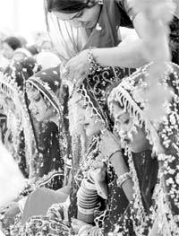 Newly wed brides at a mass marriage function held in Mohali on Sunday.
