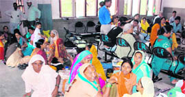 Due to inadequate seating arrangements, patients and their attendants sit on the floor in the General Hospital, Sector 6, Panchkula.