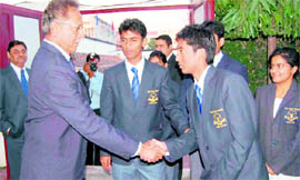 Former Indian cricketer Anshuman Gaekwad meets students of Asian School in Dehradun on Sunday.