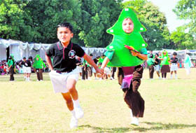 Boys take part in a fun race at St Josephs Academy in Dehradun on Sunday.