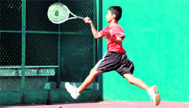 A player in action at the 11th Uttarakhand State Open Junior Tennis Tournament in Dehradun on Sunday.