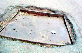 A damaged lid in the middle of the Mall Road in Mussoorie.