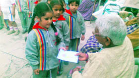 Students of Cherry Fields kindergarten celebrate Diwali with denizens of Prem Dham in Dehradun on Saturday.