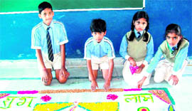 Children of Bachpan Play School show their rangolis in Haridwar on Saturday.