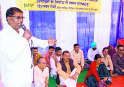 Members of the BJP Panchayati Raj Cell hold a protest in Dehradun on Sunday