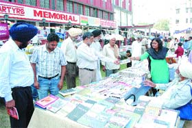 People take a look at books at Mela Ghadari Babeyaan Da in Jalandhar