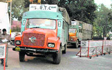 An official checks documents of a truck, carrying official records from 