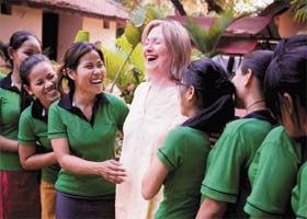US Secretary of State Hillary Rodham Clinton shares a laugh with a group of girls from the Siem Reap Centre that provides rehabilitation, vocational training, and social reintegration for sex trafficking victims in Siem Reap, Cambodia