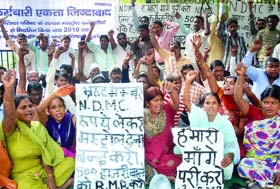 NDMC employees demand regularisation of their jobs near NDMC head office at Parliament Street in New Delhi