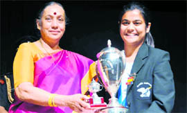Sidhima Nigam being given the Spirit of Welham trophy by Governor Margaret Alva.
