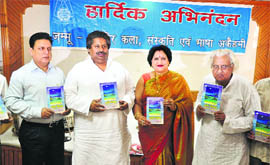Relief and Rehabilitation Minister Raman Bhalla releases poet Shyam Dutt Parags book at KL Sehgal Hall in Jammu on Monday.