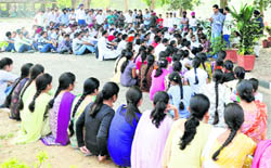 PAU students sit in protest in support of their demands on Monday. 