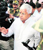 RJD chief Lalu Prasad comes out of a polling booth after casting his vote during the fourth phase of the Bihar Assembly polls in Danapur on Monday.