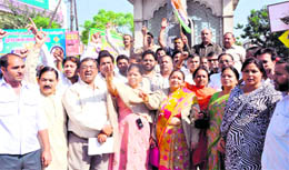 Congress workers protest against the poor working of the BJP-led Municipal Committee in Haridwar on Tuesday
