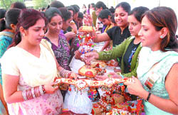 Visitors look at the decoration material prepared by students of Hans Raj Mahila Mahavidyala in Jalandhar. 