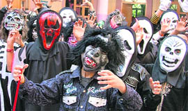 Students dressed in scary costumes take part in a Halloween party at GMT Public School in Ludhiana.