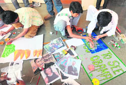Children make sketches and paintings of US President Barack Obama in Mumbai