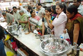 Shoppers select utensils on the auspicious occasion of Dhanteras at the Dhobi Bazaar in Bathinda on Wednesday