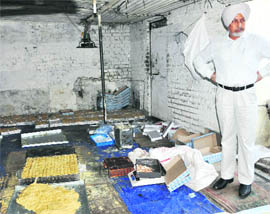 Chandigarh additional deputy commissioner PS Shergill inspects a sweets-manufacturing factory at Mani Majra on Wednesday.