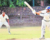 A player hits the ball during a match at St Stephens School, Sector 45, Chandigarh, on Wednesday.