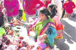 People buy utensils on the occasion of Dhanteras in Pitthoragarh on Wednesday.