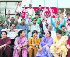 Members of the Clerical Staff Association belonging to various departments hold a demonstration in Jammu on Wednesday.