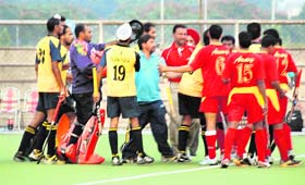 Players of the Punjab and Sind Bank and Armi-XI enter into a scuffle during a match in Ludhiana on Wednesday