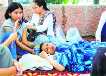 This file photo shows Nobel Peace Prize 2005 nominee, Irom Chanu Sharmila (C) attended to by her supporters in New Delhi. 