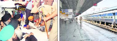 The police tries to persuade Khalsa Action Committee chairman Mohkam Singh to clear the railway line in Amritsar; and (right) Jalandhar railway station presents a deserted look on Wednesday