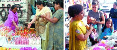 Customers buy earthen lamps and terra cotta figurines of gods and godesses at Khiloniyan Wala Bazaar and (right) women buy khand khidone at Mishri Bazaar in Amritsar
