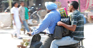 Residents going home after purchasing crackers on the eve of Divali in Bathinda on Thursday.