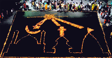 City residents celebrate Divali eve by lighting diyas at Sector 17, Chandigarh, on Thursday.