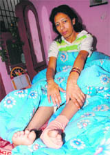 The victim, Santosh, at her residence in Baltana.