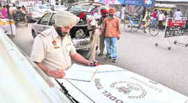 Policemen search a vehicle on the eve of Divali in Ludhiana on Thursday.