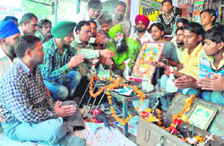 Mechanics worship Lord Vishwakarma in Sector 48, Chandigarh,