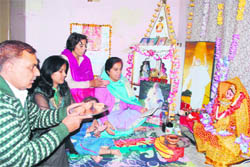 A family offers prayers during Govardhan Puja in Dehradun