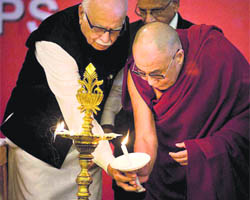 The Dalai Lama (R) and BJP senior leader Lal Krishna Advani light a lamp to inaugurate a three-day international conference of Tibet support groups at Surajkund on Friday.